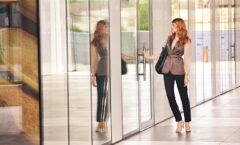 Woman opens conference room door for meeting